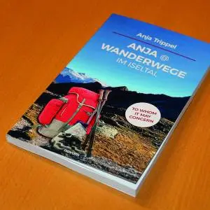 Ein Buchcover mit rotem Rucksack und Wanderstöcken, Titel: 